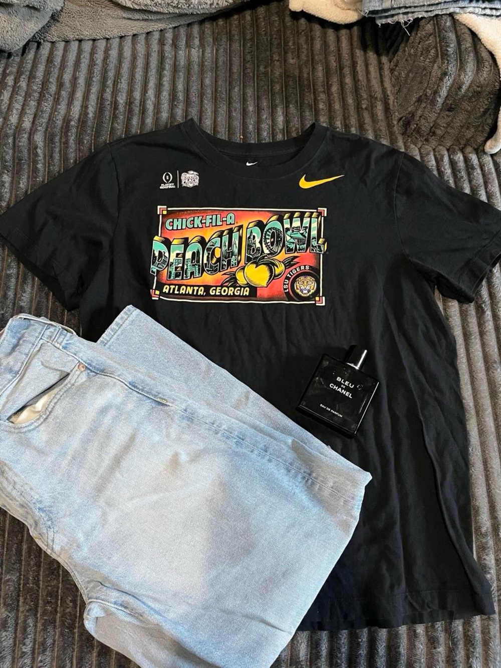 Nike Black Graphic Tee with Light Blue Jeans